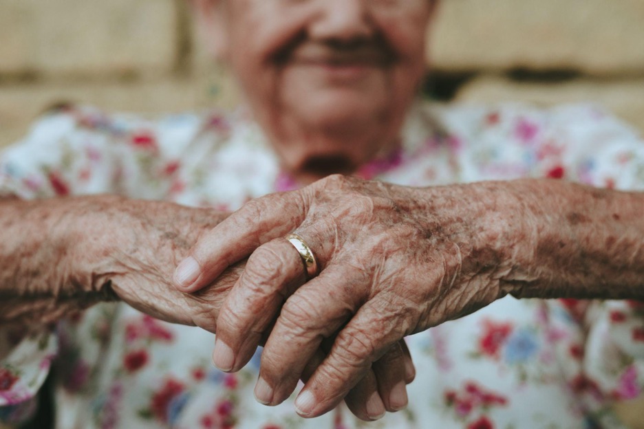 elderly-woman-hands-and-smile