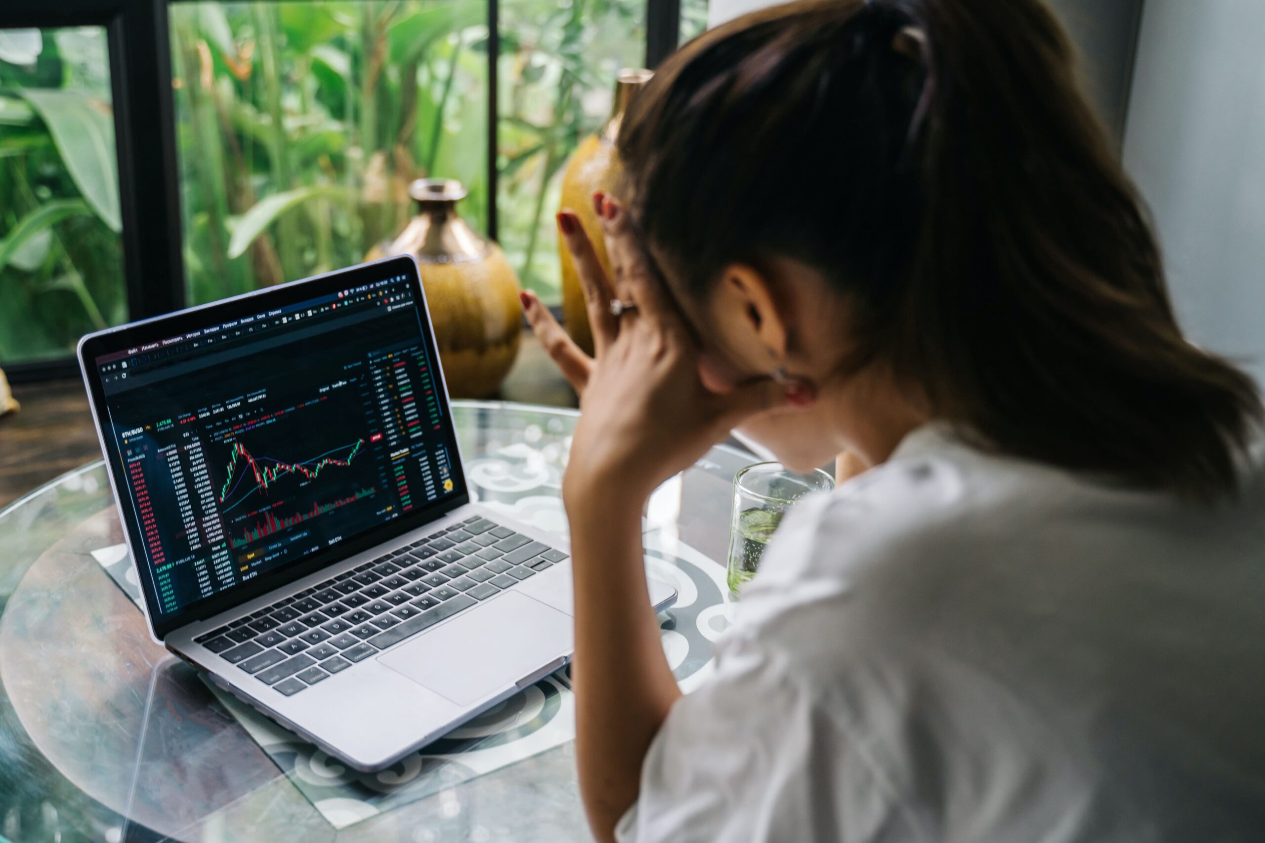 woman stressing over stock prices financial lessons